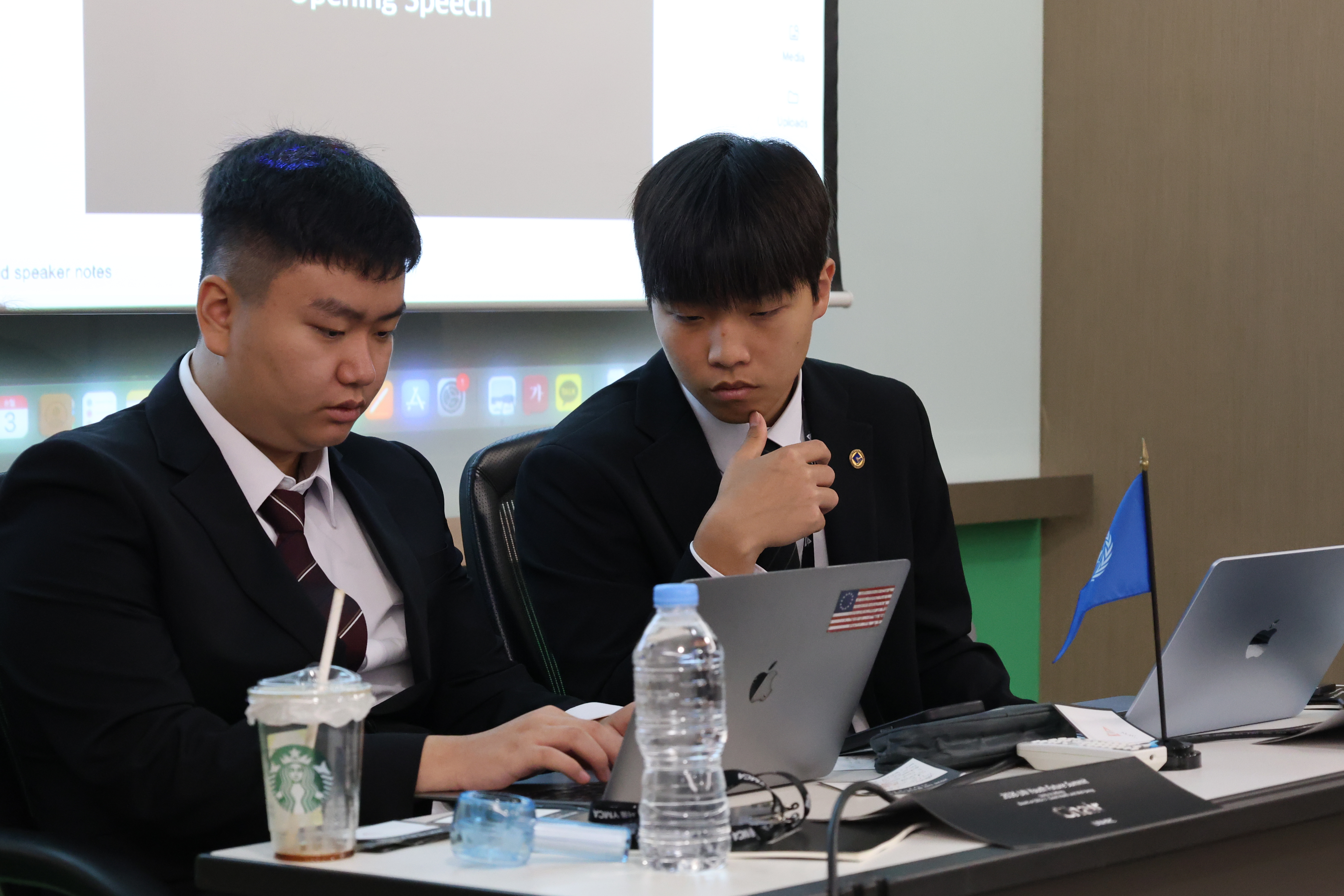 Head Chair reviewing documents during committee session