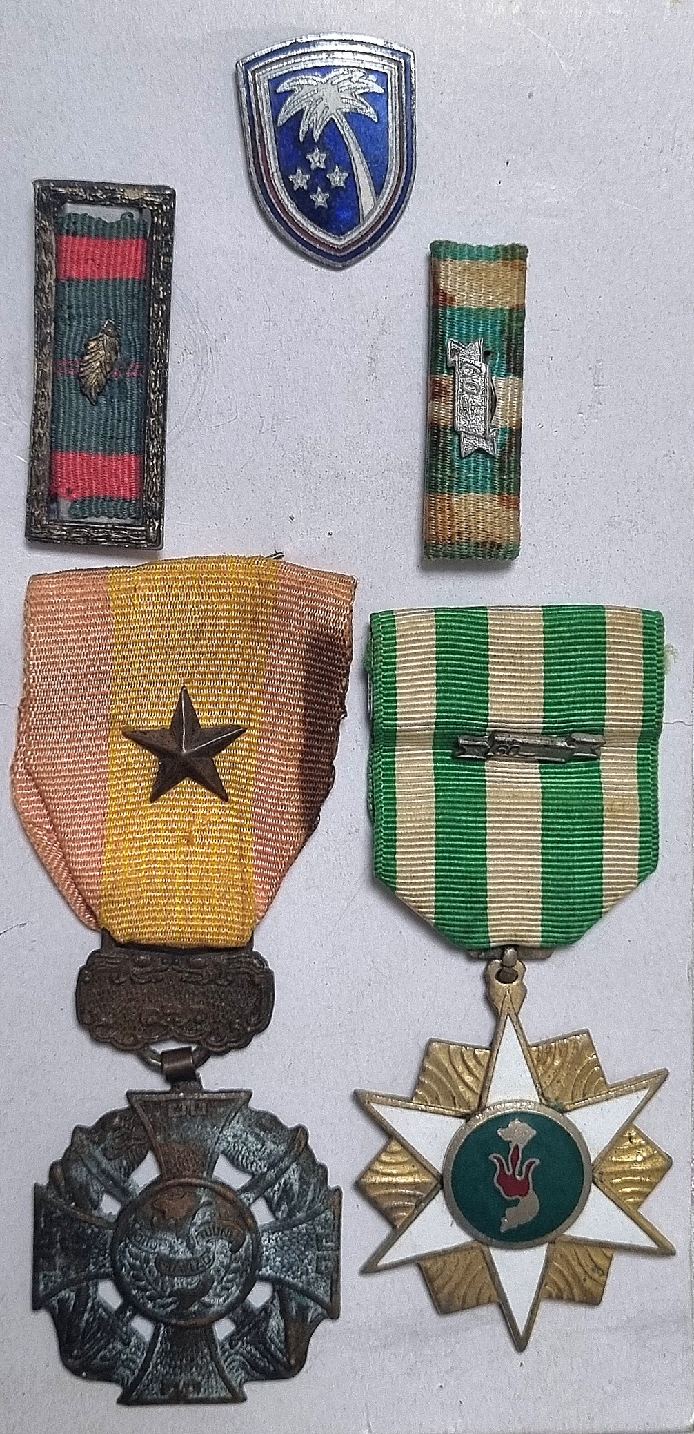 Collection of military medals and badges from Vietnam War service